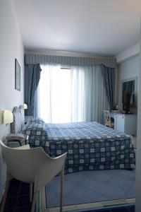 Postel nebo postele na pokoji v ubytování Hotel Santa Caterina