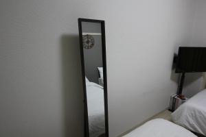 Postel nebo postele na pokoji v ubytování LUANA in KICHIJOJI