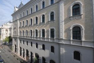 a large white building with many windows on a street at Luxury Apartment Opposite Budapest Opera, Central, AC, Metro 1, Sleeps 6 in Budapest