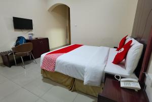 Postel nebo postele na pokoji v ubytování SH Hotel