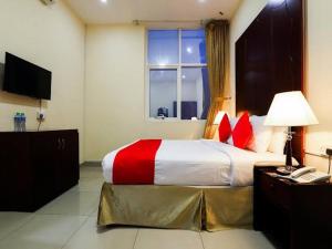 Postel nebo postele na pokoji v ubytování SH Hotel