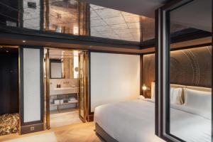 Ein Bett oder Betten in einem Zimmer der Unterkunft Almanac Palais Vienna