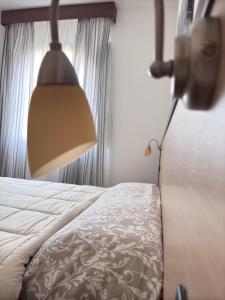 Postel nebo postele na pokoji v ubytování Vecchio Frantoio Villa Rosa