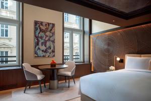 Ein Bett oder Betten in einem Zimmer der Unterkunft Almanac Palais Vienna