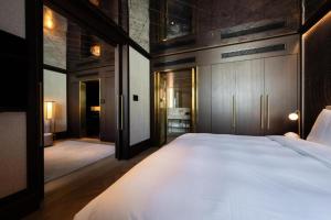 Ein Bett oder Betten in einem Zimmer der Unterkunft Almanac Palais Vienna