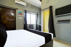 Hotel O Rewansh in客房内的一张或多张床位