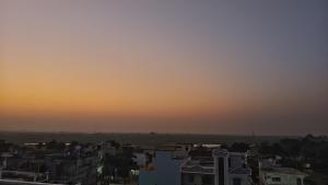 a view of a city skyline at sunset at Capsule Hostel And PG Services in Gorakhpur