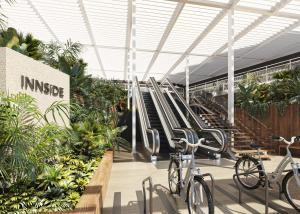 a building with bikes parked in front of escalators at INNSiDE by Meliá Alicante Porta Maris in Alicante