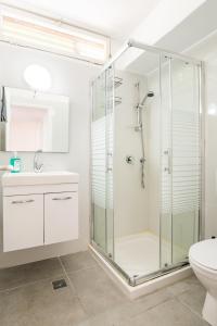 a bathroom with a shower and a toilet at Sea view 2 bedroom apartment in Haifa