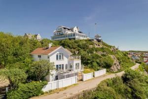 a white house on top of a hill at Modern Villa With Sea Views In Picturesque Mölle in Mölle