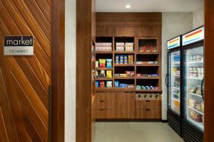 a grocery store aisle with a refrigerator and food at Courtyard New York Downtown Manhattan/Financial District in New York +16 photos