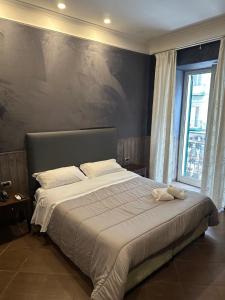 Кровать или кровати в номере Smart Station Hotel