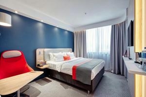 Кровать или кровати в номере Holiday Inn Express - Almaty by IHG