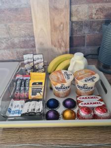 a tray of food with muffins and other snacks at The Hide in Ullapool