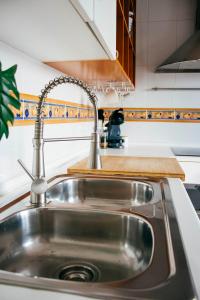 Kuchyň nebo kuchyňský kout v ubytování Apartamento Atico-Spa + 37 fotografií