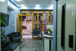 a room with yellow doors and a table and chairs at mansion yellow hotel in Istanbul