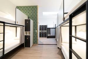 Postel nebo postele na pokoji v ubytování Koba Hostel