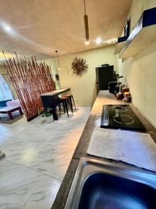 a kitchen with a stove top in a room at Casa de vacaciones completa in Acapulco +59 photos