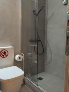a bathroom with a shower and a toilet at Vagia in Tríkala