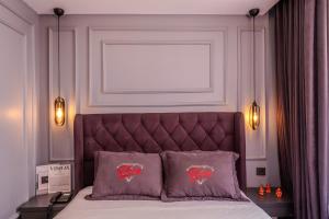 Letto o letti in una camera di Ruby Hotel