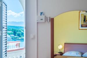 Postel nebo postele na pokoji v ubytování Apartments Barbara