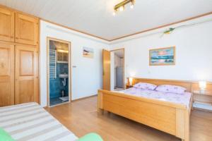 Postel nebo postele na pokoji v ubytování Apartments Barbara