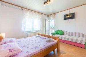 Postel nebo postele na pokoji v ubytování Apartments Barbara
