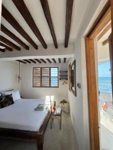 Postel nebo postele na pokoji v ubytování Mango Beach House