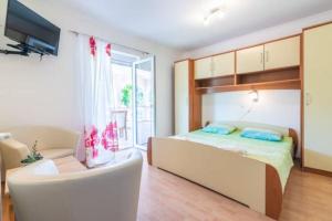 Postel nebo postele na pokoji v ubytování Apartments Barbara