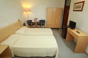 Ένα ή περισσότερα κρεβάτια σε δωμάτιο στο Hotel San Vitale +84 φωτογραφίες