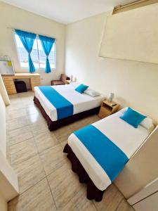Postel nebo postele na pokoji v ubytování Hotel Crucero