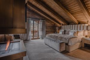 Rúm í herbergi á Ultima Hotel Gstaad