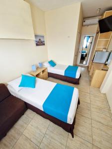 Postel nebo postele na pokoji v ubytování Hotel Crucero