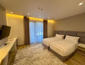 TV a/nebo společenská místnost v ubytování Henry Resort & Spa