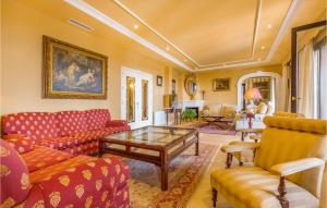 a living room with couches and a table at 6 Bedroom Awesome Home In Marbella in Marbella