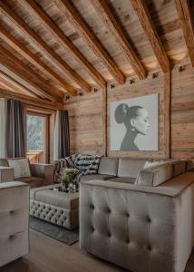 a living room with a couch and a table at Ultima Hotel Courchevel in Courchevel