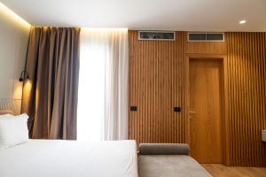 Postel nebo postele na pokoji v ubytování Henry Resort & Spa