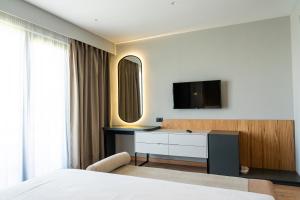 Postel nebo postele na pokoji v ubytování Henry Resort & Spa