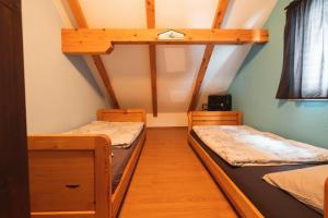 Postel nebo postele na pokoji v ubytování Planinska Kuća OBLAK