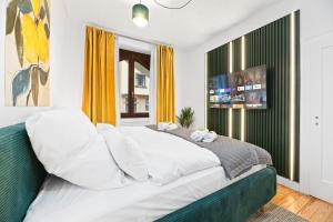 Televiisor ja/või meelelahutuskeskus majutusasutuses Lemon3 - CityNest mit Balkon & Workspace - Nähe Bahnhof