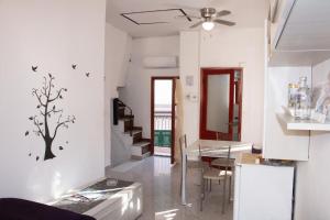 a living room with a table and a dining room at Loft Vernazza Heart in Vernazza