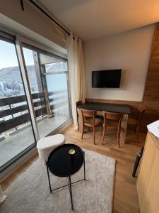 Et tv og/eller underholdning på Appartement esprit chalet avec balcon centre La Clusaz