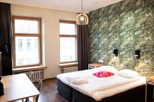 Postel nebo postele na pokoji v ubytování Hotel Finn