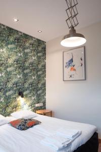Postel nebo postele na pokoji v ubytování Hotel Finn