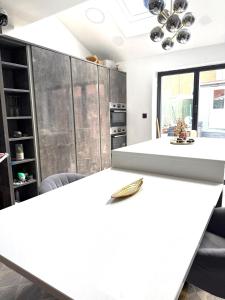 a kitchen with a white counter top in a room at Rose home in Haverhill +3 photos