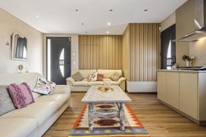 Posezení v ubytování Cozy Apartments by Homie