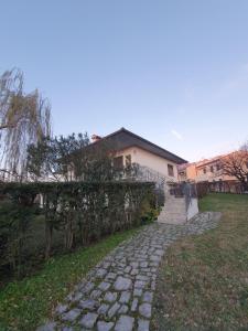 a stone path in front of a house at La Corte Industriale in Crespano del Grappa