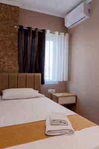 Postel nebo postele na pokoji v ubytování Lider Hotel