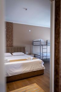 Postel nebo postele na pokoji v ubytování Lider Hotel