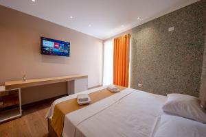 Postel nebo postele na pokoji v ubytování Lider Hotel